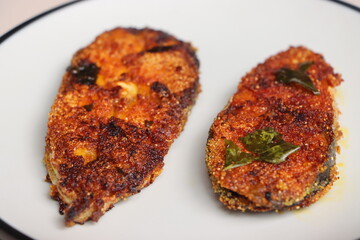 Indian fish fry, Basa or Pangasius, pan fried, marinated with spices