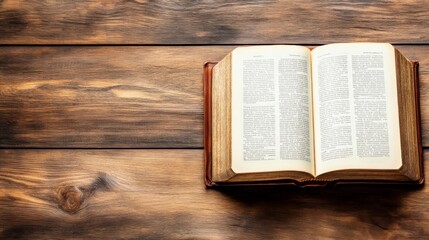 Obraz premium Open book placed on a wooden surface with visible grain and texture