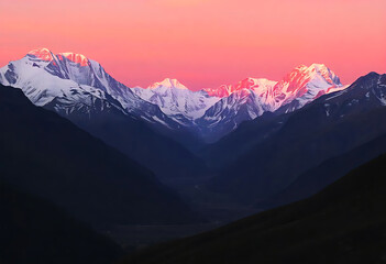 Majestic mountain peaks illuminated by sunset golden hour light and dramatic tones