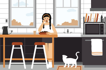 Woman having breakfast with her cat in the kitchen.