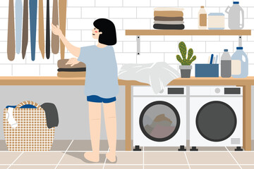 Woman hanging clothes in the laundry room.