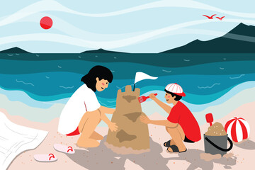 Brother and sister building a sandcastle on a summer beach.
