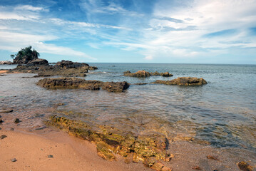 Tranquil Coastal View of Pantai Kuala Kemasik with Rocky Shoreline, Terengganu, Malaysia - This serene coastal scene captures the natural beauty of Pantai Kuala Kemasik in Terengganu, Malaysia.