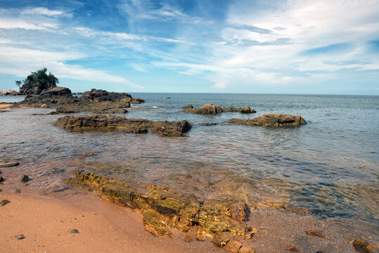 Tranquil Coastal View of Pantai Kuala Kemasik with Rocky Shoreline, Terengganu, Malaysia - This serene coastal scene captures the natural beauty of Pantai Kuala Kemasik in Terengganu, Malaysia.