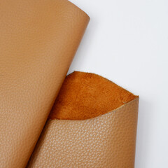 close up photo of genuine dark brown cowhide with orange peel pattern