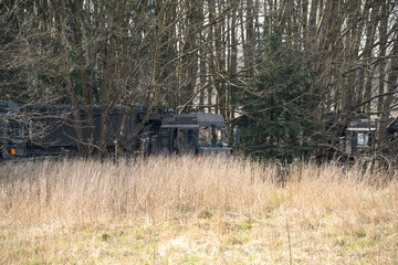 army MAN SV 4x4 haulage logistics trucks under woodland cover