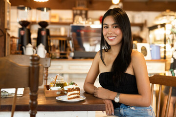 Portrait of beautiful young woman in coffee shop