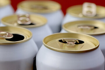 Cold canned beer ready to drink in the fridge