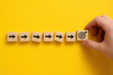 Progress toward a defined objective is represented by a series blocks aligned in a sequence symbolizing continuous achievement in goal-oriented business strategies