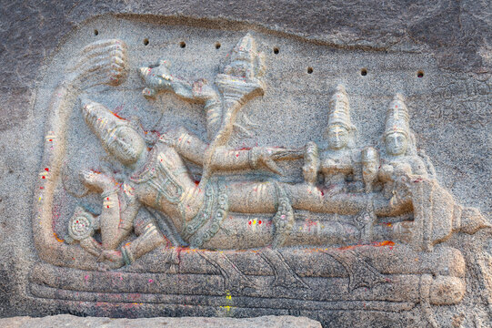 Ancient Jaya statue of dwarpal of Vishnu, Virupaksha temple of Hampi, carved into boulder, hinduism religion, god, ganesh at ruin of Vijayanagara Empire