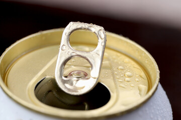 Cold canned beer ready to drink in the fridge