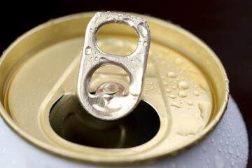 Cold canned beer ready to drink in the fridge