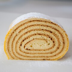 Detailed studio image of sponge roll cake slice with soft sponge and rich filling – sponge roll wallpaper – bakery wallpaper – sponge roll image


