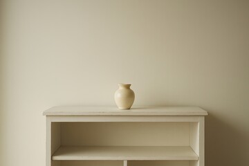 Fototapeta premium Single cream ceramic vase on vintage white shelf against blank wall, minimalist interior and lifestyle
