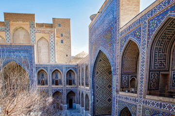 Part of Registan Square in Samarkand, Uzbekistan, a historic architectural ensemble featuring three stunning madrasas. In old arabic God is great on the walls
