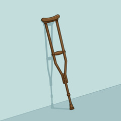 Wooden crutch leaning against a light blue wall, symbolizing support and recovery