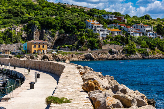 Pier with a lighthouse in Baska on the island of KRK,