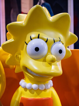 Parma, Italy - march 15 2025: Close-up of Yellow cartoon character Lisa Simpson Statue with pearl Necklace