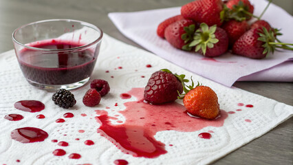 Fresh Berries And Juice Spilled On Kitchen Paper Towel