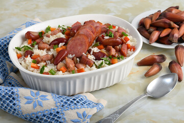A delicious Brazilian dish of rice with sausage, bacon and pine nuts
