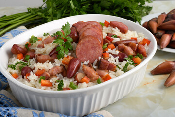 A delicious Brazilian dish of rice with sausage, bacon and pine nuts
