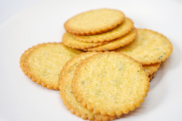 Thin round biscuits crackers stacked together close-up, Sweet and tasty round butter crackers.