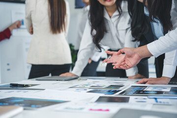 Business team analyzing financial documents and explaining investment strategy discussing new marketing data at meeting