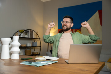 Happy businessman warming up body and muscles at workplace feeling satisfied with work done