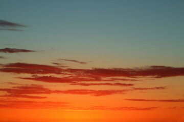 Turquoise and orange sunset sky background with clouds (Tenerife, Spain)