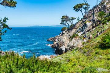 Point Lobos State Natural Reserve in California USA features turquoise waters, rugged cliffs, and...