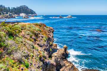 Point Lobos State Natural Reserve in California USA features turquoise waters, rugged cliffs, and...