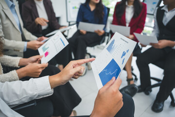 Business people reviewing charts and graphs, analyzing financial data and discussing statistics...