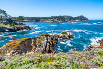 Point Lobos State Natural Reserve in California USA features turquoise waters, rugged cliffs, and...