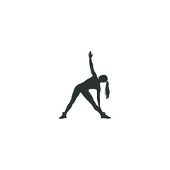 Silhouette of woman performing triangle yoga pose for fitness and wellness