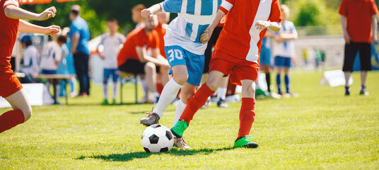 Youth Soccer Match in Action – Kids Compete on a Sunny Day in Team Uniforms on Green Grass Field