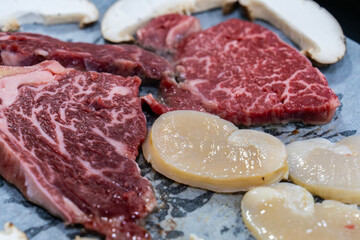 roasting beef, scallop and shiitake mushroom on the pan