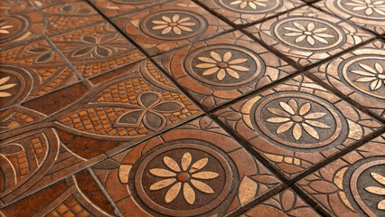 Tiles with floral patterns in brown tones done in a traditional style