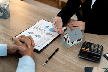 Young business woman is talking about presenting real estate