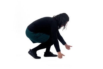 side view of a woman lifting something heavy from the ground on white background