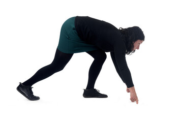 side view of a woman wearing shorts in starting position for a race.