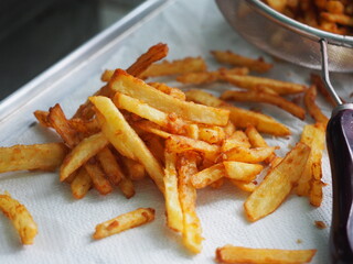 pile of french fries on paper towel