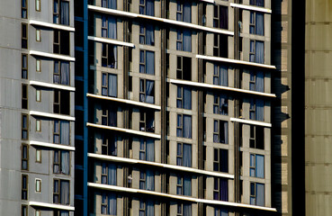 Modern Apartment Building Facade with Repetitive Window Pattern
