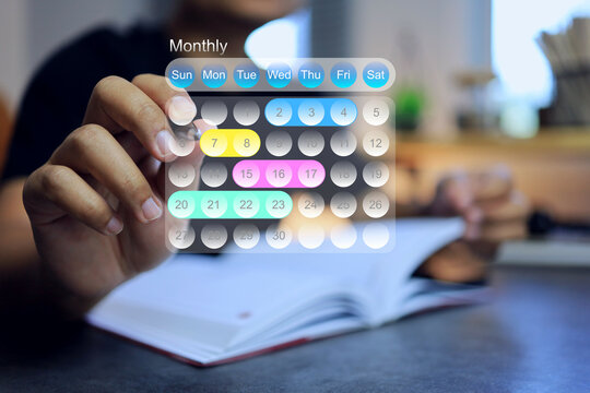 man marking calendar to set schedule and appointment and reminder to do activities event