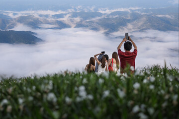 Tourists enjoy the beautiful view of Mon Cham Mountain and Resort, morning fog in the rainy season at Mae Rim, Chiang Mai, Thailand.