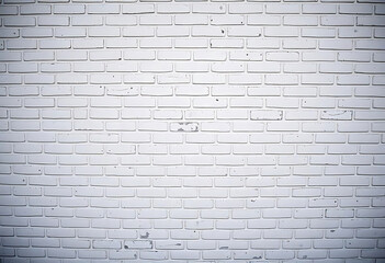 White brick wall background texture with rustic detail and vignette for design projects