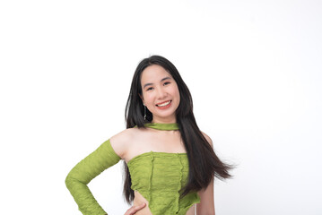 Asian teenager strikes a confident pose in a green asymmetrical ruched top, embodying...