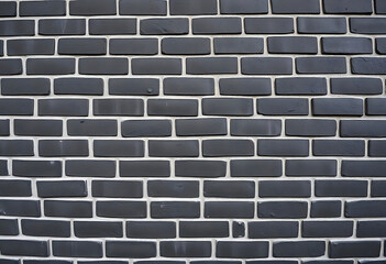 Close up view of dark grey brick wall texture background design element