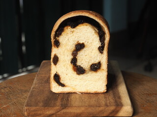 sliced loaf of white sandwich bread with raisin