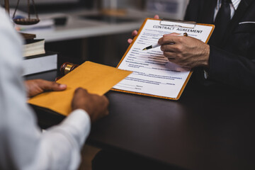 Lawyer receiving envelope with money for bribery. Corrupt lawyer receiving a bribe in an office, showcasing unethical behavior in law and finance. Hands accept money envelope.