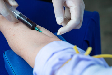 Close up hand collecting blood sample for diagnosis and treatment patient in the...